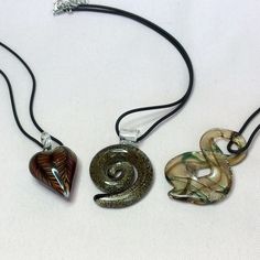 Lampwork Pendant Comes On An Adjustable Leather Cord. 1. Brown/Black Striped Heart, 2 1/8” (Yec), 2. Golden Glitter Swirl, 2.5” (Ylc) Or 3. Figure 8, 2.5” (Kcc). All Come With Leather Cord Adjustable Necklace That Can Be Worn From 17.5-20”. Thanks! Physical Manifestation, Striped Heart, Funky Accessories, Lampwork Pendant, Fan Necklace, Blue Statement Necklace, Floating Necklace, Diy Jewelry Unique, Crystal Fashion