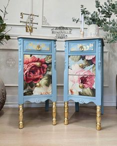 two blue nightstands with flowers painted on them