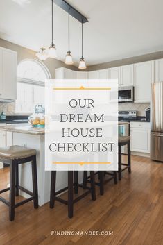 a kitchen with white cabinets and an island in the middle that says our dream house checklist