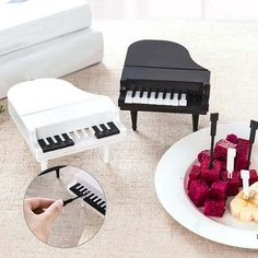 a piano and fruit on a white plate