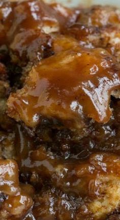 a close up view of some food on a plate with meat and gravy