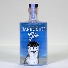 a bottle of gin with an image of a ferret on it