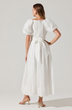 Short sleeve V-neck midi dress Smocked back with concealed zipper closure and tie details Large puff sleeve Front hook closure at bust Fully lined Self: 100% Viscose / 100% Polyester Dry clean only Style #ACDR102285 Category: White Dresses