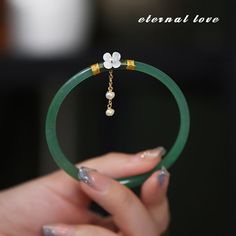 Gender: WomenMaterial: MetalMetals Type: Zinc alloyBracelets Type: Charm BraceletsOrigin: Mainland ChinaCN: ZhejiangItem Type: BraceletsCompatibility: All CompatibleShape\pattern: RoundModel Number: LZ30285Setting Type: Bezel SettingFine or Fashion: FashionStyle: TRENDY Elegant Jade Pearl Bracelet For Gift, Jade Bracelet For Wedding, Elegant Jade Bracelets For Wedding, Elegant Green Jade Bracelet, Elegant Green Jade Pearl Bracelet, Elegant Green Charm Bracelet With Round Beads, Jade Bracelet As Gift, Delicate Green Bracelet Jewelry, Dainty Green Bracelets For Wedding