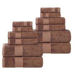 six brown towels stacked on top of each other