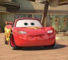 the character cars from disney pixars is shown in front of a building