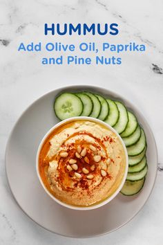 hummus with cucumbers and olive oil, paprka and pine nuts