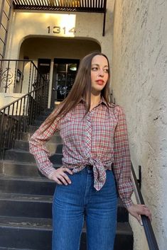 "70s Red Plaid Metallic Long Sleeve Blouse Beautiful 70s red plaid metallic blouse. Fabric is an exquisite lightweight blend of 60% cotton and 40% poly. Stunning metallic gold threading woven throughout the red blue and white plaid fabric. Button closure at the wrist. A bit of volume in the sleeves as well. So pretty. The bottom button has been replaced. See last photo.  By Licorice X Measurements: 38\" bust 15.5\" shoulder 23\" sleeve length 25.5\" full length in front 25.5\" full length in bac Classic Plaid Blouse For Fall, Fall Daywear Plaid Blouse, Fitted Plaid Blouse For Fall, Plaid Blouse For Daywear In Fall, Vintage Plaid Blouse For Fall, Fall Gingham Button-up Blouse, Retro Plaid Blouse For Fall, Fitted Plaid Button-up Blouse, Vintage Plaid Tops For Fall