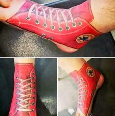 the foot is painted red and has white laces on it's toes, with an image of a shoe in the middle