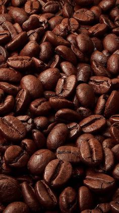 a pile of coffee beans is shown in this image