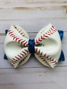 "Baseball skin glitter hair bow made with brand new Rawlings baseballs. Listing is for a single bow.  Each bow is about 4\" x 3\".  Option to pair with various colors of glitter or mix n match of available colors. (Pictured bows are paired with royal blue color glitter). Note: This is a made-to-order item, it will be shipped within 3 days once ordered." Sports Hair Bows, Softball Hair Bows, Stacked Hair Bow, Stacked Hair, Glitter Hair Bows, Special Occasion Hairstyles, Glam Hair, Sequin Bow, Glitter Hair