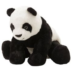 a black and white stuffed panda bear sitting down