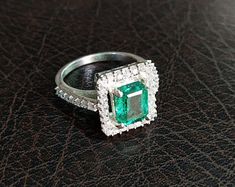 Lab created emerald ring sterling silver square cut | Etsy Radiant Cut Emerald Ring In Sterling Silver For Wedding, Sterling Silver Square Cut Emerald Ring For Anniversary, Emerald Cut Sterling Silver Halo Ring Gift, Square Cut Emerald Diamond Ring For Anniversary, Radiant Cut Emerald Ring With Halo Setting For Promise, Wedding Emerald Ring With Square Cut, Square Cut Diamond Jewelry For May Birthstone, Rectangular Emerald Ring With Halo Setting, Asscher Cut Emerald Ring With Halo Setting For Promise