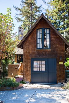 a house with a large garage in front of it