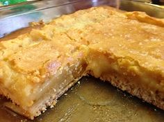 two pieces of pie sitting on top of a metal pan