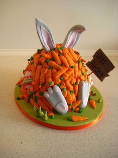 a cake made to look like carrots with bunny ears