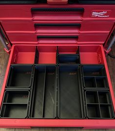 a red toolbox filled with lots of compartments