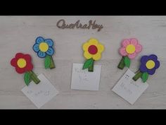 three paper flowers on top of each other with note cards attached to them and the words,