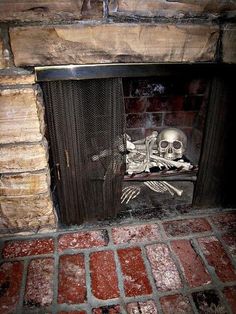 a fireplace with a skeleton sitting on top of it