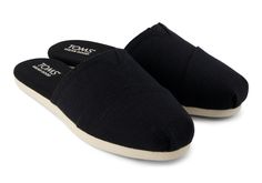 Part Alpargata, part mule—all style. This slip-on has a signature TOMS silhouette and easygoing black uppers with an open back to slide on and off with ease. Custom CloudBound™ insoles offer comfort and support for days you need it most. | RMAT Outsole: Premium rubber blend that provides cushion, rebound and durability Non-removable custom CloudBound™ foam insoles for all-day comfort and support. Elastic gore for easy fit. Exclusive to TOMS. com. TOMS is a proud member of the Fair Labor Association—working with suppliers that conduct their businesses ethically, engage with workers, ensure safe working conditions, and establish human rights compliance and social responsibility. When you buy TOMS, you help fund access to mental health resources for the millions of people who need them. Wear Comfortable Black Slip-ons For Spring, Black Closed Toe Slip-ons With Cushioned Footbed, Black Cushioned Slip-ons For Spring, Casual Black Slip-ons For Workwear, Comfortable Black Mules For Spring, Comfortable Black Spring Mules, Casual Black Slip-on Mules, Black Slip-on Mules With Cushioned Footbed, Black Cushioned Slip-on Mules