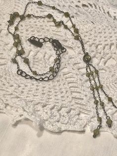 "Sweet Vintage 1928 Necklace 18\" Green Beaded Chain , Lobster clasp , 18\" chain and then a large green stone set in metal and triple drop of 2 1/2\" inches of more of the green beaded chain All set in dark metal In great vintage condition! We ship to USA only check out our other items! http://www.etsy.com/shop/oldstuffetc" Green Metal Chain Necklace With Adjustable Chain, Green Beaded Metal Necklaces, Green Beaded Chain Necklace For Jewelry Making, Adjustable Green Metal Necklaces, Oval Picture Frames, Dark Metal, Bracelet Display, Hand Ring, Keepsake Jewelry