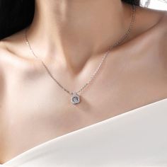 An eye-catching round moissanite dances with ease at the center of this appealing women's necklace, expressing your unstoppable love. Additional round gem set in sterling silver frame the center. Features Moissanite was originally found in meteorites(Chemical name: Silicon Carbide). It was first discovered in 1893, while a scientist was examining meteor samples from a crater in Arizona. After many years, the experts has been recreated moissanite in the laboratory, that make the gemstone with fri Dazzling Lab Grown Diamond Necklaces, Elegant Silver Solitaire Necklace With Lab Grown Diamond, Silver Lab Grown Diamond Solitaire Necklace, Elegant Silver Solitaire Necklace With Lab-grown Diamond, White Gold Necklace With Center Round Stone, Diamond Necklace With Center Stone As A Gift, Elegant Silver Solitaire Necklace, White Gold Necklace With Center Stone, Dazzling Sterling Silver Solitaire Necklace With Halo