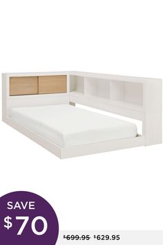 the bed frame is white and has a wooden headboard with drawers on each side