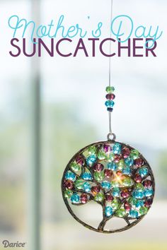 a suncather hanging from a window with the words mother's day on it