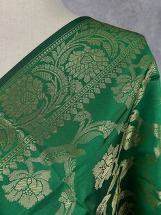 Beautiful GreenColor Floral dupatta with black color tassels. Dupatta has floral Jaal all over. Item: Dupatta Base color : Green with muted Gold Zari Fabric : Soft Silk (Not Pure Silk) Work : Zari Weaved with tassels Length of the Dupatta : 92 inches approx. Width of the dupatta : 35 1/2 inches (Approx.) Store Policies - No return or exchange will be accepted for color variations. - No return or exchange will be accepted if the color does not match your other clothing or your partners or anyone else. - Since this Dupatta is handmade hence little inconsistencies may be there however it is not considered as a defect. - Zari or thread coming out or on folds is not considered as defects. - Slight variation in actual color vs. image is possible due to the screen resolution. - For more Store pol Luxury Katan Silk Dupatta In Traditional Drape, Luxury Handloom Dupatta For Traditional Ceremonies, Luxury Traditional Cotton Silk Dupatta, Luxury Dupatta With Pallu For Ceremonial Use, Luxury Sheer Katan Silk Dupatta, Luxury Slub Silk Ceremonial Dupatta, Cheap Festive Katan Silk Dupatta, Luxury Brocade Handloom Dupatta, Luxury Katan Silk Dupatta With Printed Border