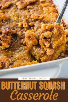 butternut squash casserole in a white baking dish with a serving spoon on top