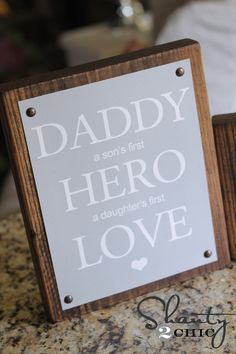 there is a sign that says daddy hero love