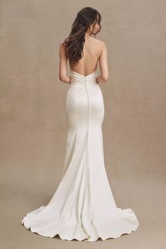 the back of a woman in a white dress