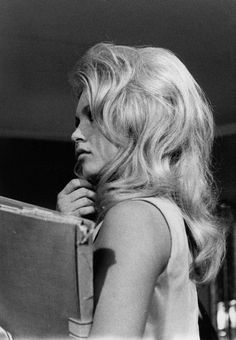 black and white photograph of a woman holding a book