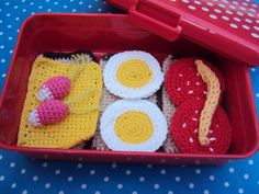 a red container filled with food on top of a blue table