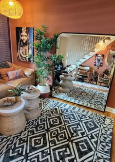 a living room filled with furniture and a large mirror