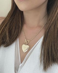 Heart Locket Toggle Necklace Details : - Heart locket for your photographs or secret messages - Thick round link chain, finished with a toggle clasp - Materials : 16K gold plated over brass - Necklace length : 18 inches - Heart Locket : 30 mm x 30 mm (~1.25 inches)- Locket inner dimension: 23 mm x 20 mm Heart Locket Necklace, Toggle Necklace, Necklace Chunky, Secret Messages, Brass Necklace, Heart Locket, Chunky Necklace, Toggle Clasp, Locket Necklace