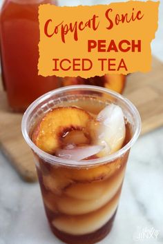 an iced drink in a plastic cup with peaches