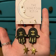 Black And Gold Boho/ Witchy Hamsa Earrings With Gold Celestial Details. Never Worn, Polymer Clay. Handmade. Bohemian Witch, Hamsa Earrings, Dangly Earrings, Jewelry Inspo, Polymer Clay Jewelry, Clay Jewelry, Gold Black, Black And Gold, Polymer Clay