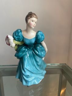 a ceramic figurine in the shape of a woman