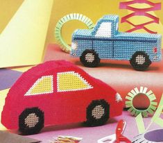 a cross stitch book with two cars on the front and one car on the back