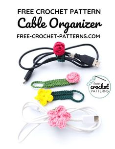 three crocheted hair clips with flowers attached to the ends, and one has a usb cable connected to it