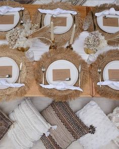 a table topped with plates and napkins covered in burlap paper next to other place settings