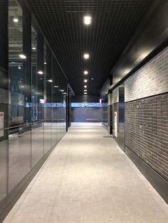 an empty parking garage with doors open and no people in the area or outside it