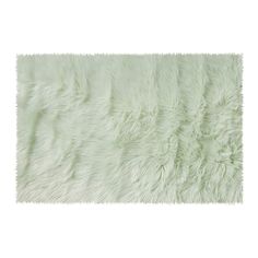 a white rug with shaggy fur on it