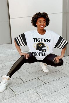 Show off your school or team spirit with our bold contrast sporty oversized short sleeve tee. Featuring trendy jersey mesh sleeves with sports striping, a ribbed neckline, and 100% cotton, it'll be easier than ever to represent in style. Collegiate White Top For Football Season, White Collegiate Top For Football Season, White Tops For Football Season Streetwear, White Streetwear Tops For Football Season, Sporty T-shirt With Team Logo For Cheerleading, White Varsity Tops For Sports Events, Sporty Team-colored Activewear For Game Day, White Sporty Top For Cheerleading, Sporty Short Sleeve Tops For College