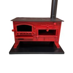 an old fashioned red wood stove with a black top and two burners on it