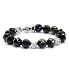 This men's beaded bracelet is a blend of cosmic wonder and earthly elegance, adorned with 84 finely-faceted golden obsidian beads and meteorite cubic bead. The Viking-era anchor-shaped sterling silver lobster clasp adds a historical touch, while the invisible elastic cord offers ease and comfort. A piece for the visionary, the strong, and the curious. Cosmic Connection Genuine meteorite fragments, a touch of the universe on your wrist. Elegance and Ease 84 finely-faceted Golden Obsidian beads, s Spiritual Silver Obsidian Bracelet, Luxury Adjustable Bracelets With Faceted Beads, Luxury Adjustable Bracelet With Faceted Beads, Luxury Gemstone Beads, Elegant Silver Obsidian Beaded Bracelets, Elegant Silver Obsidian Bracelets, Modern Silver Bracelets With Gemstone Beads, Luxury Polished Rondelle Beads Bracelets, Luxury Rondelle Bracelets With Polished Beads