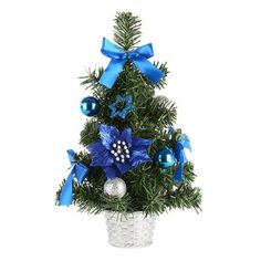 a small christmas tree in a basket with blue bows and ornaments on it's top