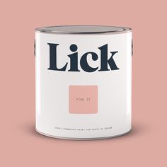 a pink and white paint can with the word lick painted on it's side