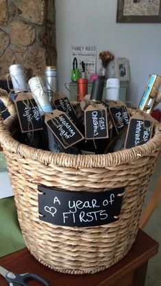 a basket filled with lots of items sitting on top of a table next to a pair of scissors